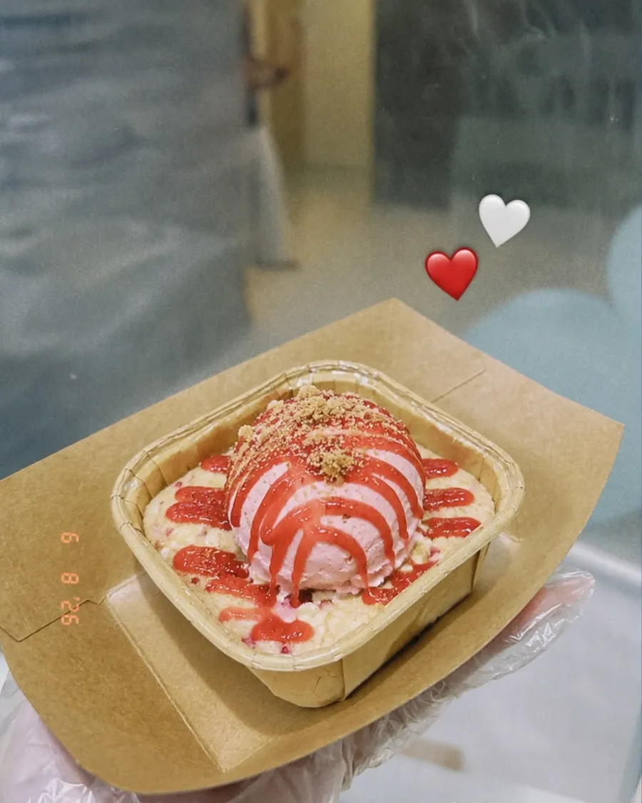 Acai bowl with pink strawberry drizzle and heart stickers