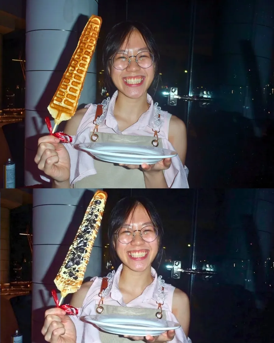 Girl holding the giant long waffle wand at night