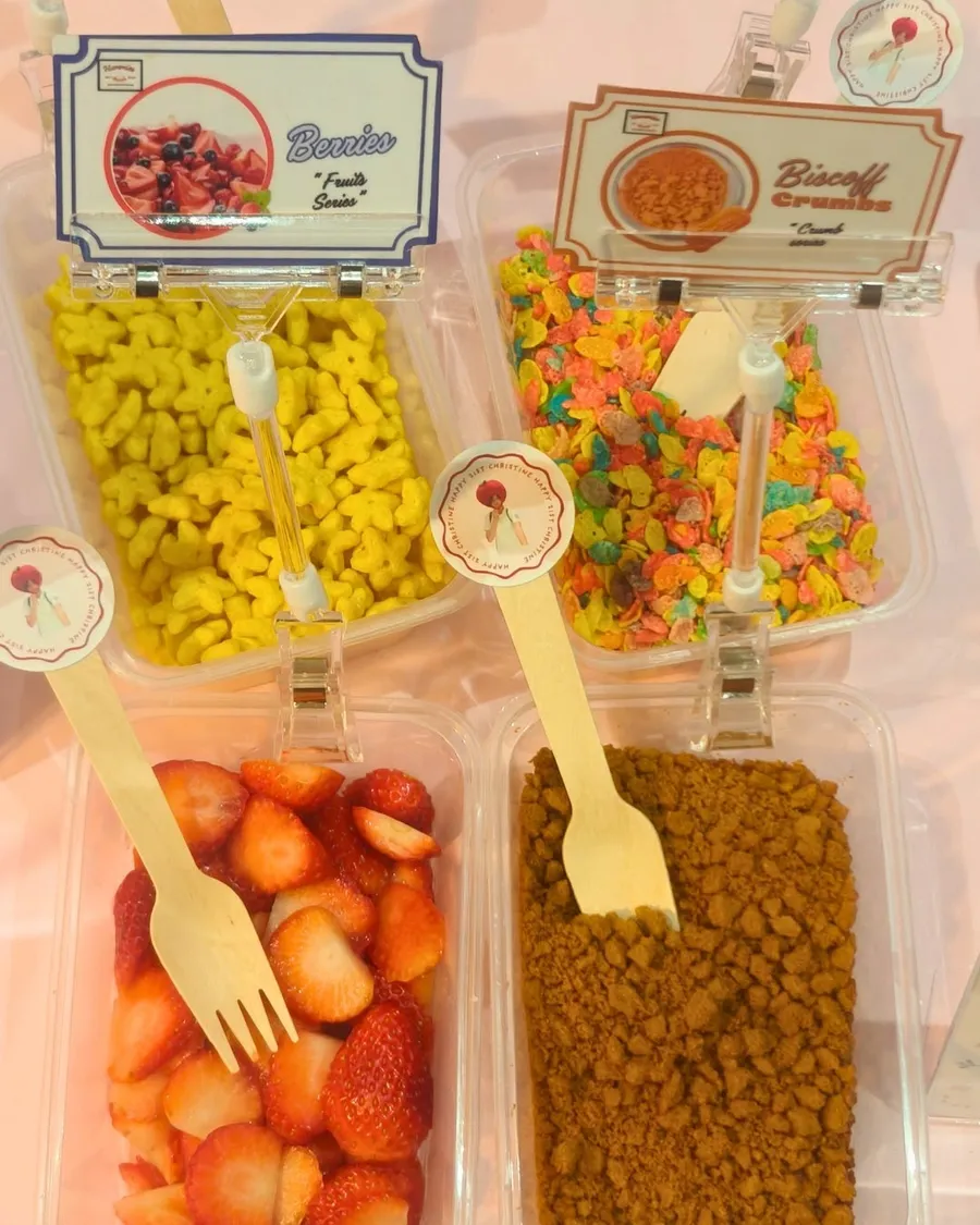 Labeled drizzles and toppings lined up at the DIY bar